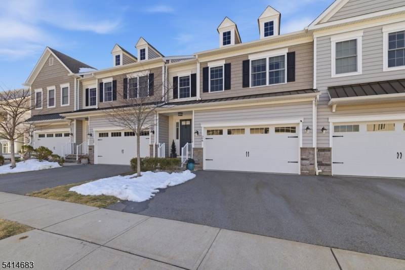 Welcome to 24 Aspen Drive in Cedar Grove's desirable Hilltop community, where comfort and convenience blend seamlessly.