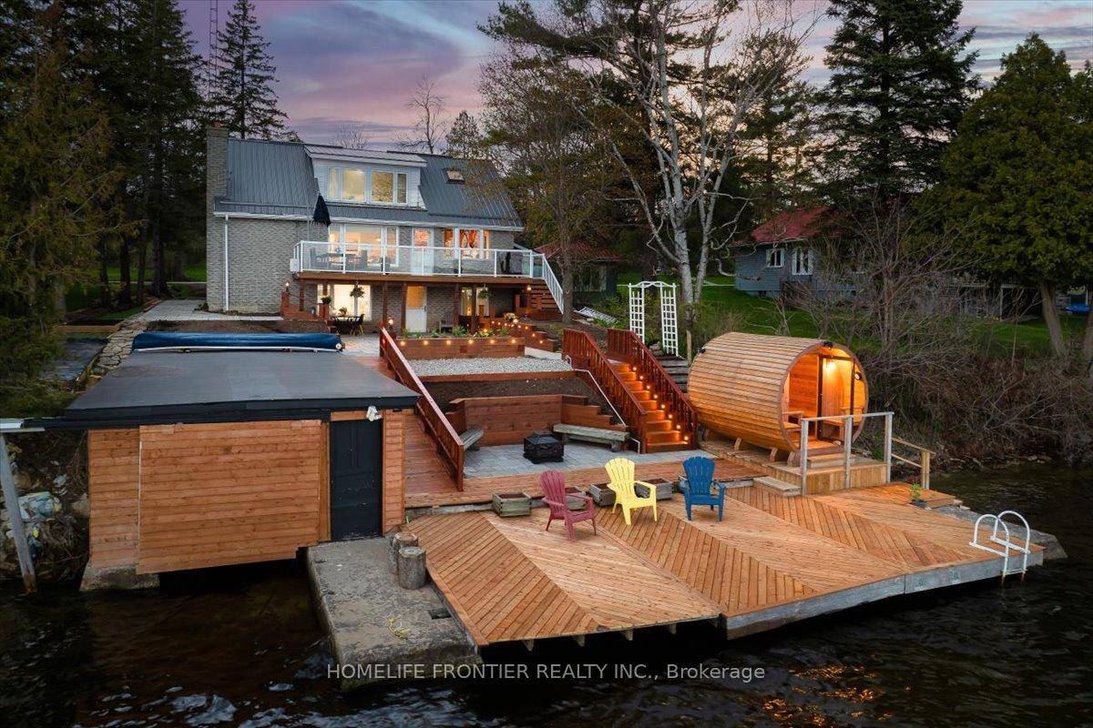 Stunning Lakefront Retreat with Breathtaking South Facing Views of Sturgeon Lake !