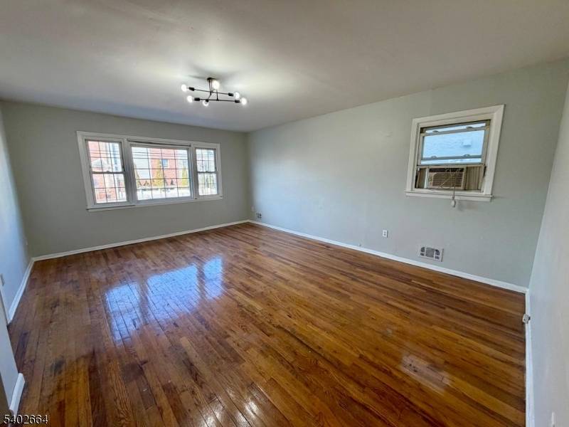 Well kept two family home, each spacious unit features 3 bedrooms and 1 full bath with hardwood floors throughout and central heat.