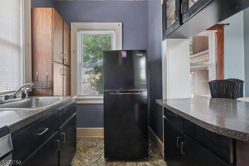 Welcome to this legal 3 family home on a corner lot, delivered vacant and offering an excellent opportunity for investors or owner occupants alike.