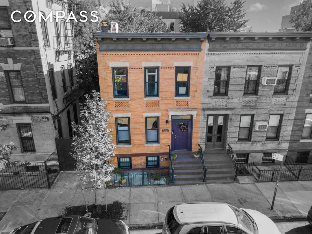 Welcome to 252 Jackson Street a serene and beautifully preserved townhouse tucked along a quiet block in Williamsburg.
