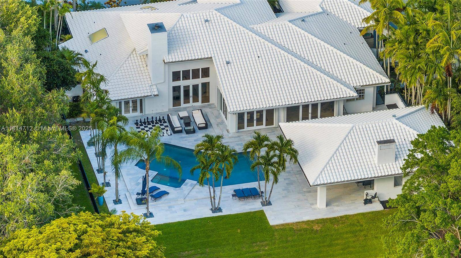 Elegant one story entertainer s delight estate with guest house in prestigious Windmill Ranch.