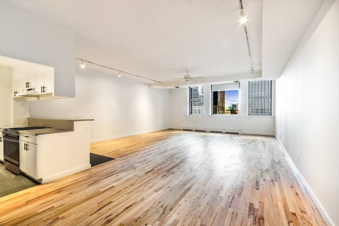 This timeless prewar loft in the heart of FiDi offers classic New York charm.