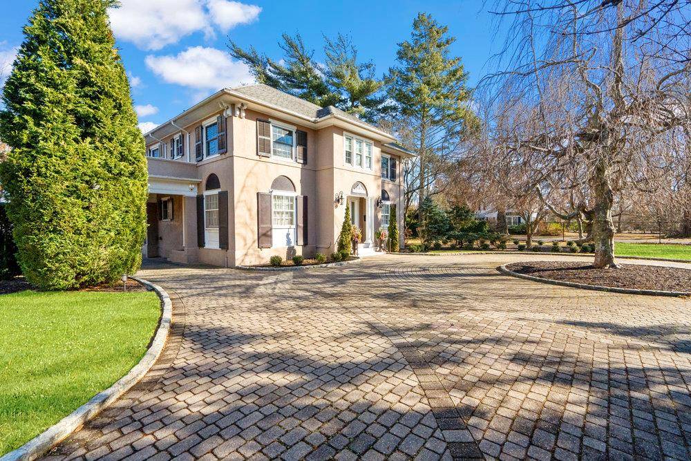 Beautiful Mediterranean style estate situated on over an acre of completely fenced in manicured grounds in South Sayville.
