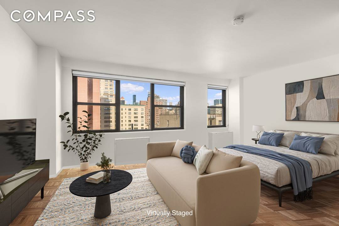 Flooded with natural light and offering sweeping city views, this spacious alcove studio instantly draws your attention with its airy feel and generous layout.