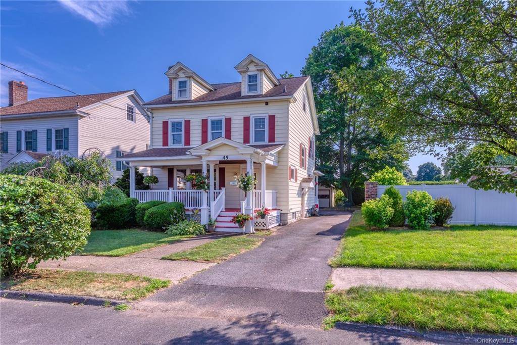 Charming Roosevelt Park 2 story home boasting original woodwork, hardwood floors, and elegant stained glass windows.