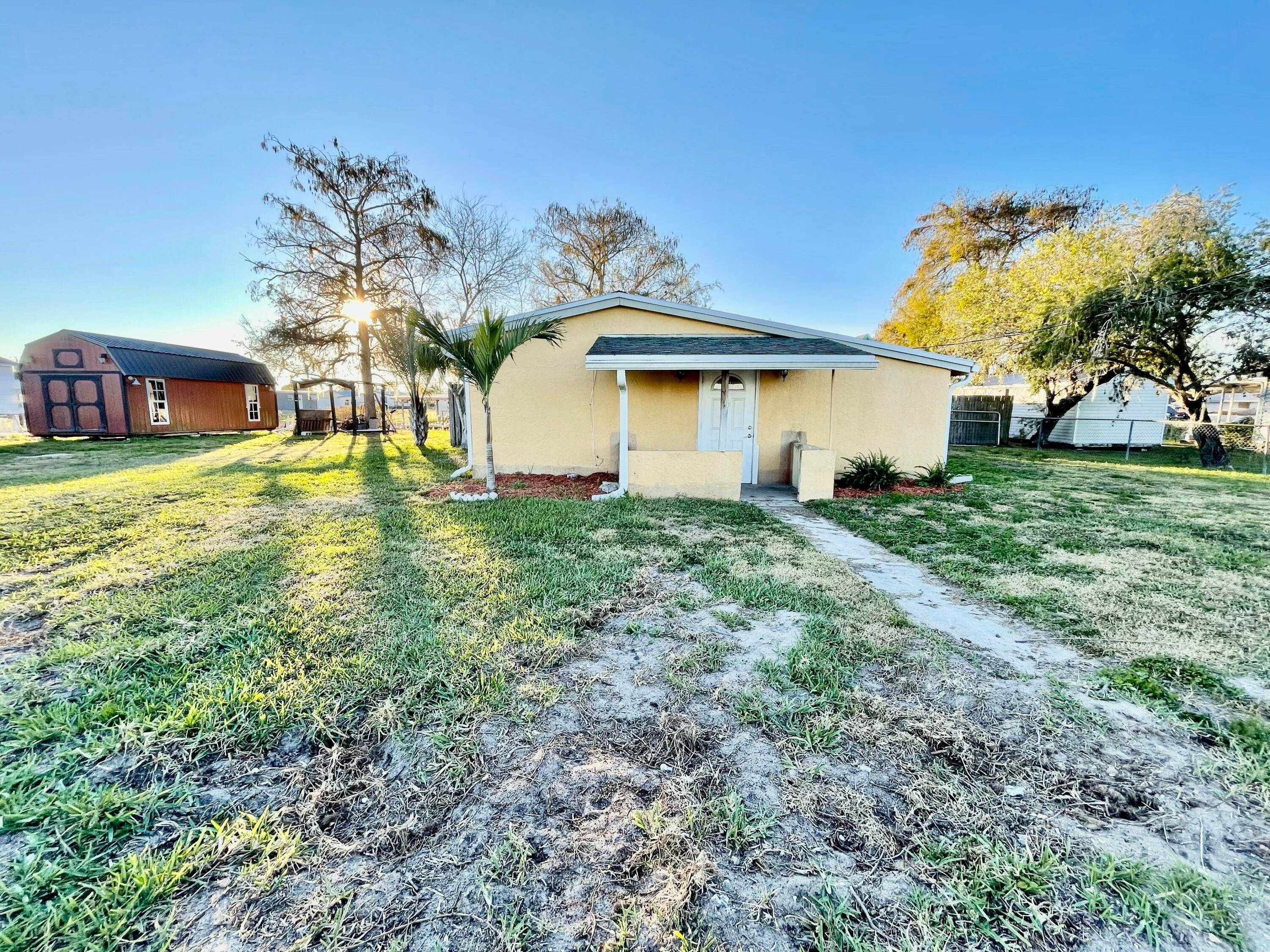 Lake Access Two separate homes located on one lot with the adjacent vacant buildable lot for sale.