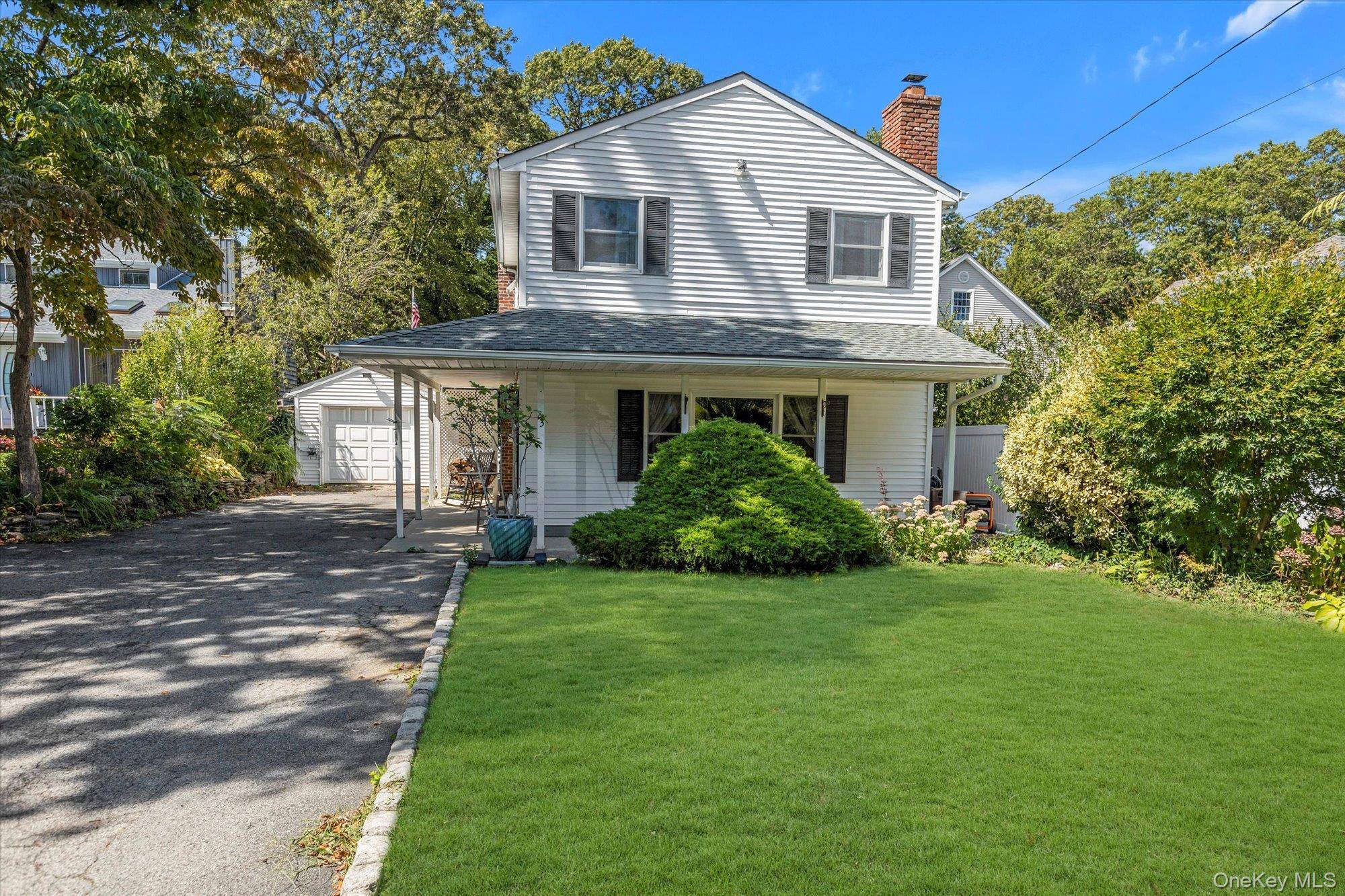 Welcome to this inviting three bedroom, two bath farmhouse style Colonial, where timeless character meets modern comfort.