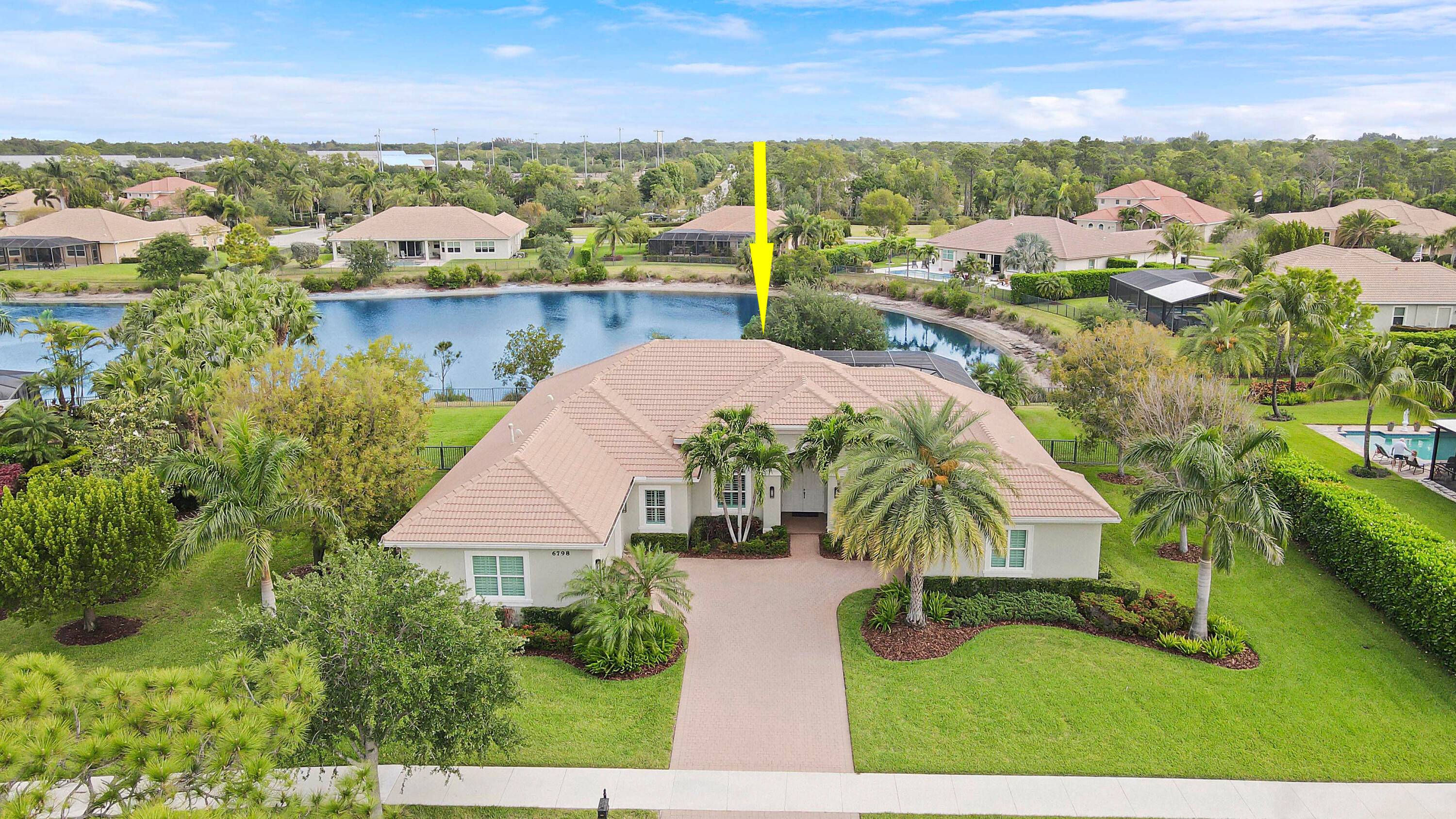 This stunning 2015 built lakefront pool home in the exclusive gated community of Tres Belle.