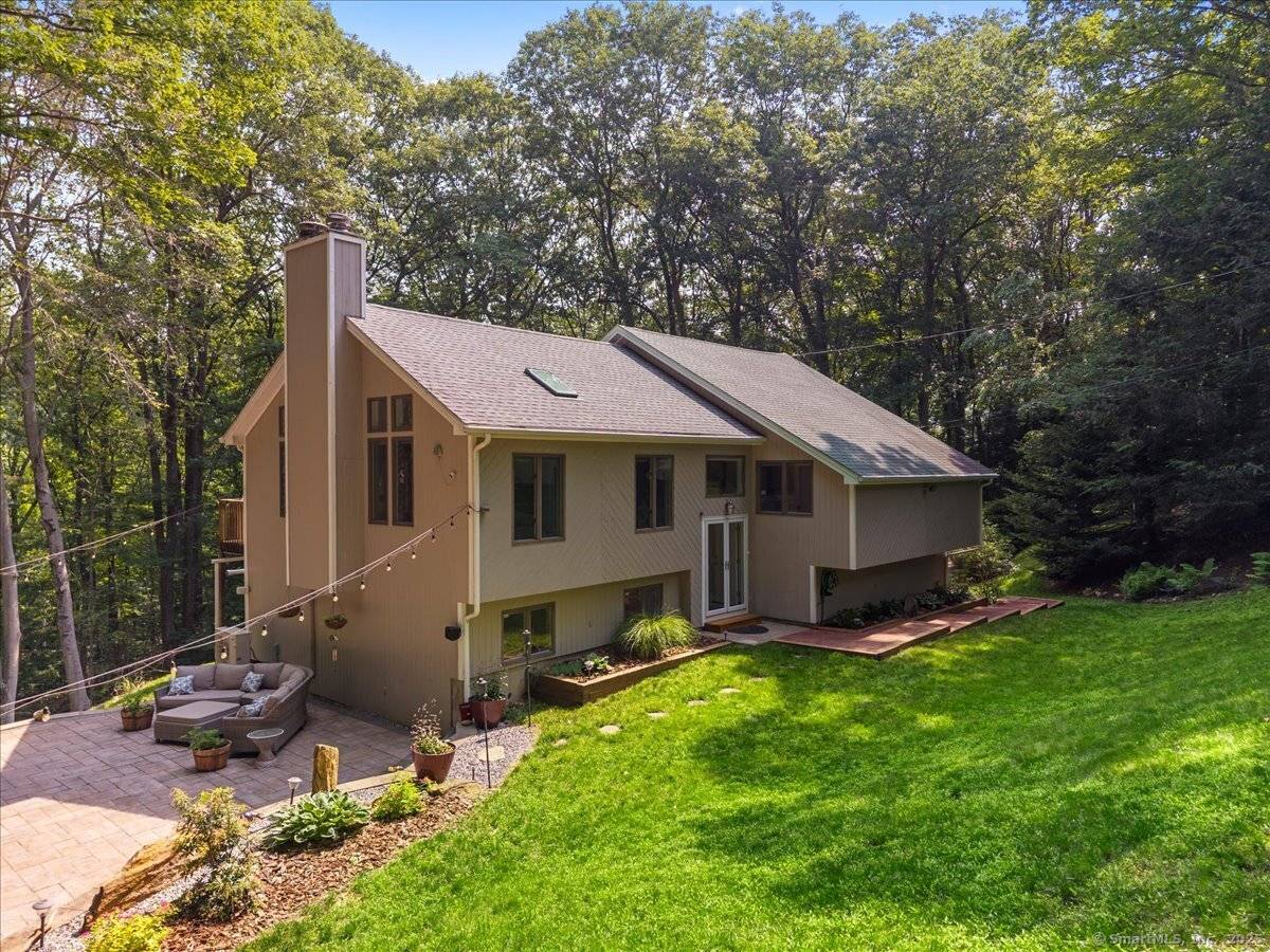 Welcome to 2 Round Hill Road, an exceptional retreat tucked away in the tranquil White Hills neighborhood, perched above the serene upper banks of the Housatonic River.