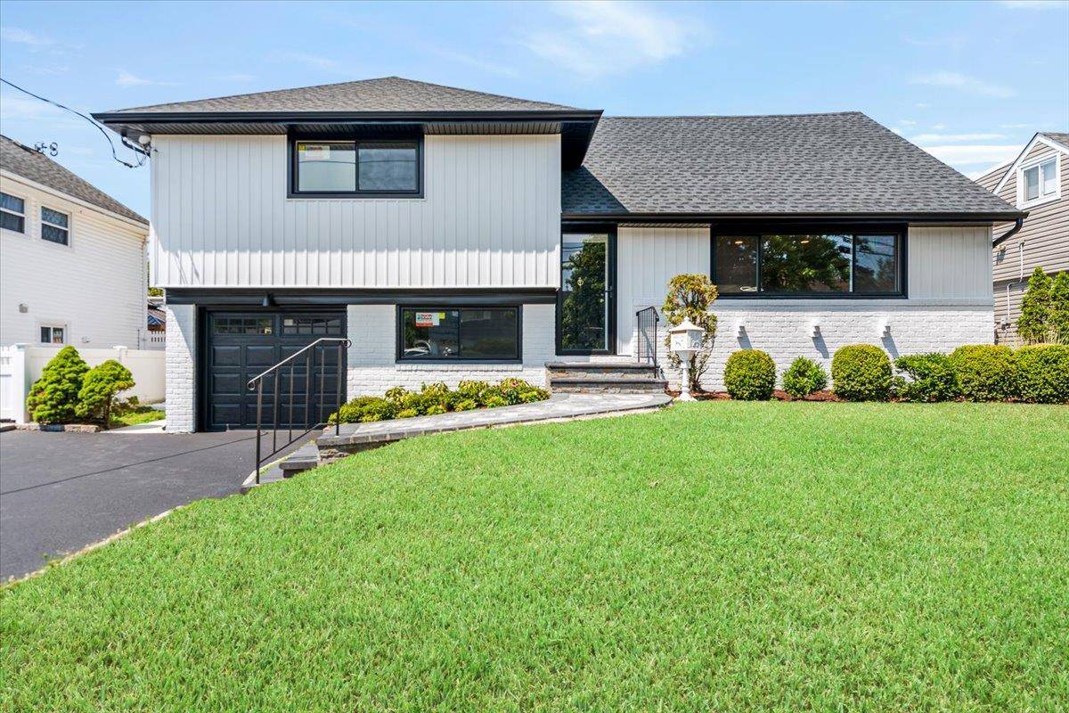 Welcome to 168 Concord Avenue, a modern oasis in the desirable Ocean Lea section of Oceanside, NY.