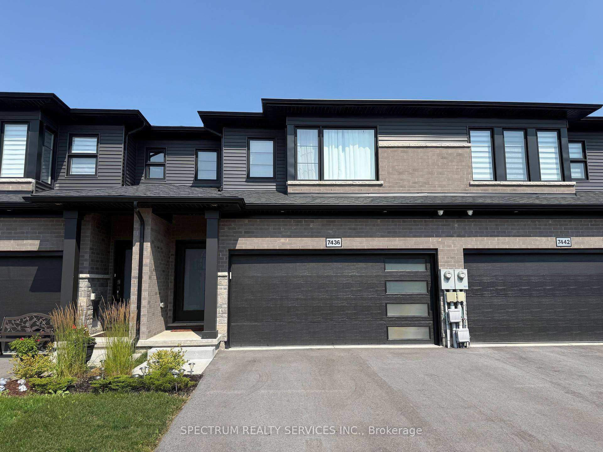 Impeccable Freehold 3 Br Townhome 1696 Sqft Above Ground With Attached Two Car Garage Locates In A Desirable Neighborhood Of New Forest View Subdivision.
