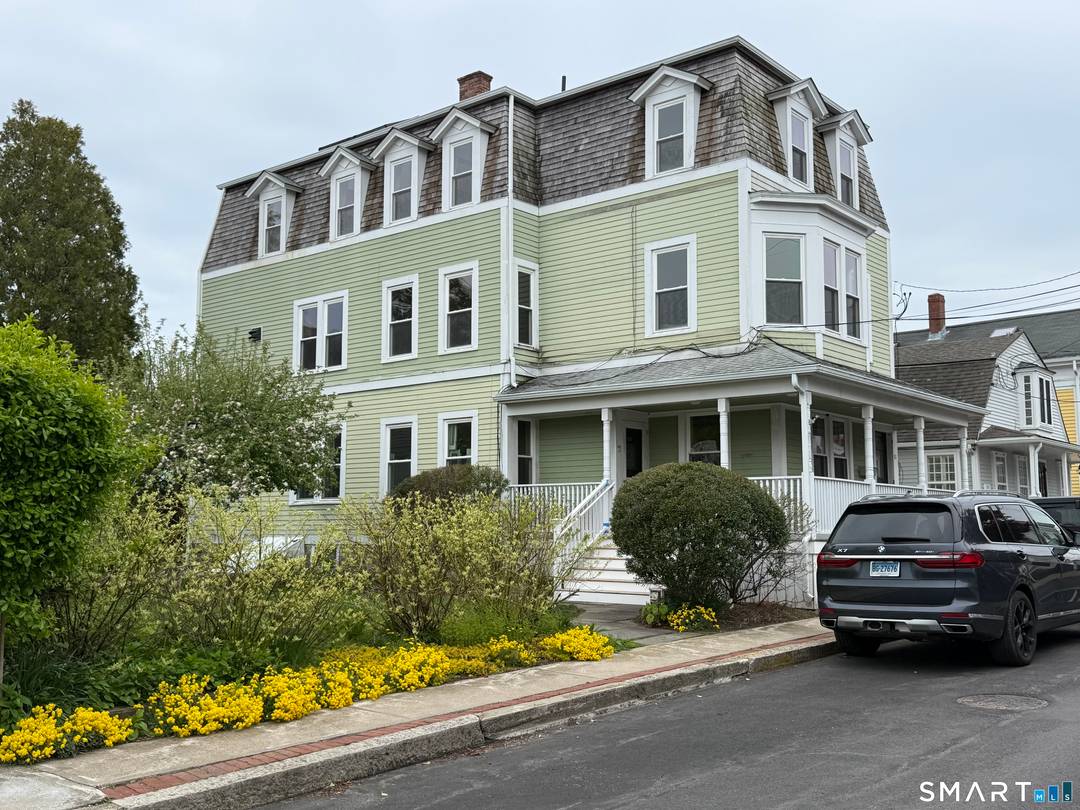 This 3 family, 3 story renovated 1899 house sits on a fenced lot with an outbuilding consisting of a one car garage and other side is a storage office room.