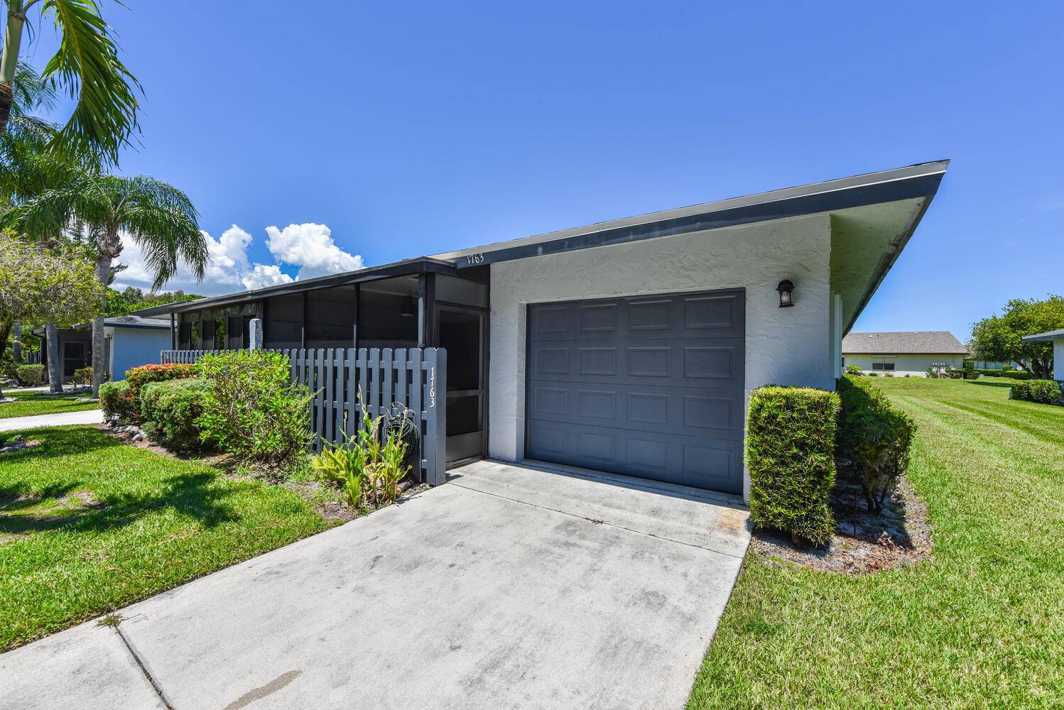 Welcome home to this stunning 2 bedroom, 2 bath end unit villa with 1 car garage, thoughtfully remodeled with modern designer finishes throughout.