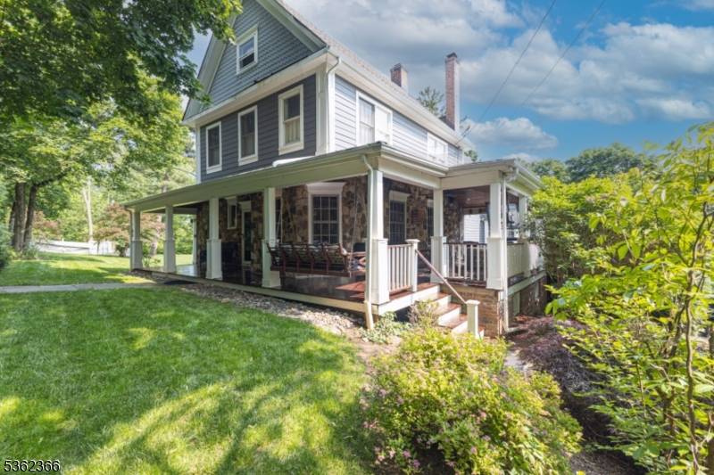 Nestled in a picturesque setting, this beautifully crafted custom home blends timeless architectural details with thoughtfully updated amenities.