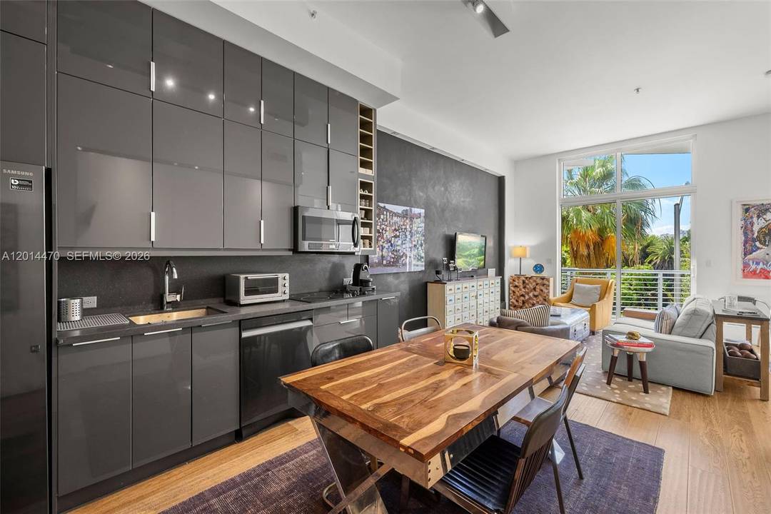 Stylish and thoughtfully renovated residence at 2001 Meridian featuring 12 foot ceilings, floor to ceiling impact windows, and an open loft style layout filled with natural light.
