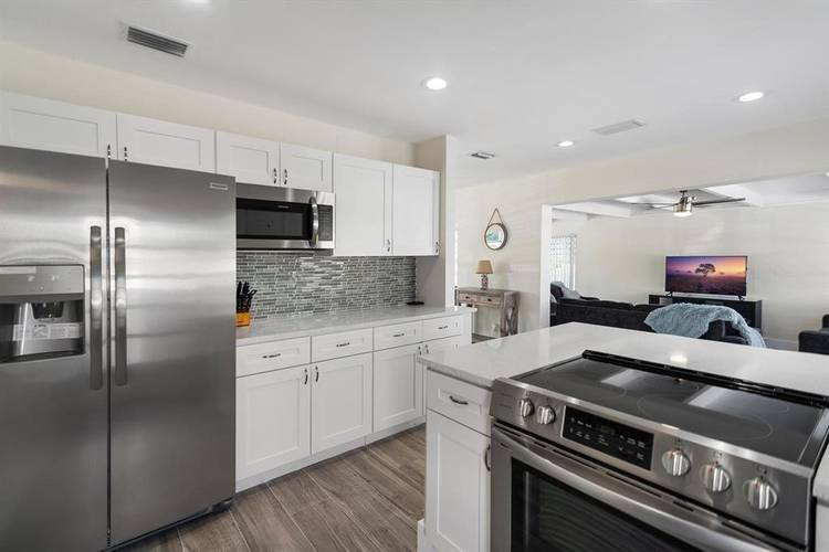 BEAUTIFULL SINGLE FAMILY HOME FOR RENT UNFURNISHED 3 BEDROOMS 2 BATHROOMS TOTALLY UPDATED, STAINLESS STEEL APPLIANCES, OPEN KITCHEN, HEATED POOL, WASHER amp ; DRYER INSIDE THE HOUSE, IMPACT WINDOWS.