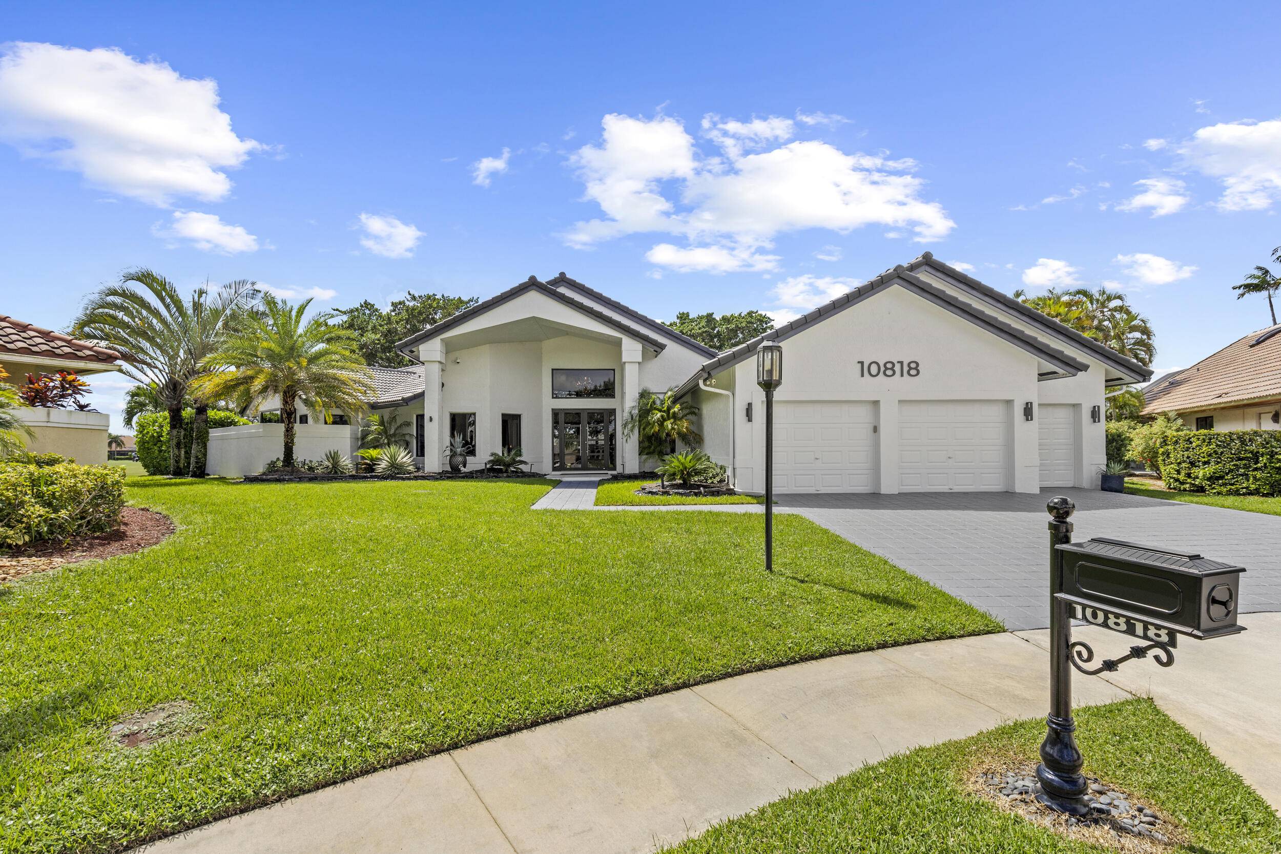 Your dream home awaits ! This beautifully updated contemporary residence is perfectly situated on an oversized cul de sac point lot with expansive lake and golf course views, offering privacy ...