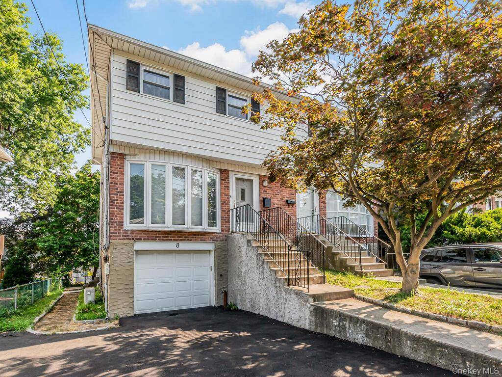 Sun filled townhouse style home offering space, comfort, and convenience.