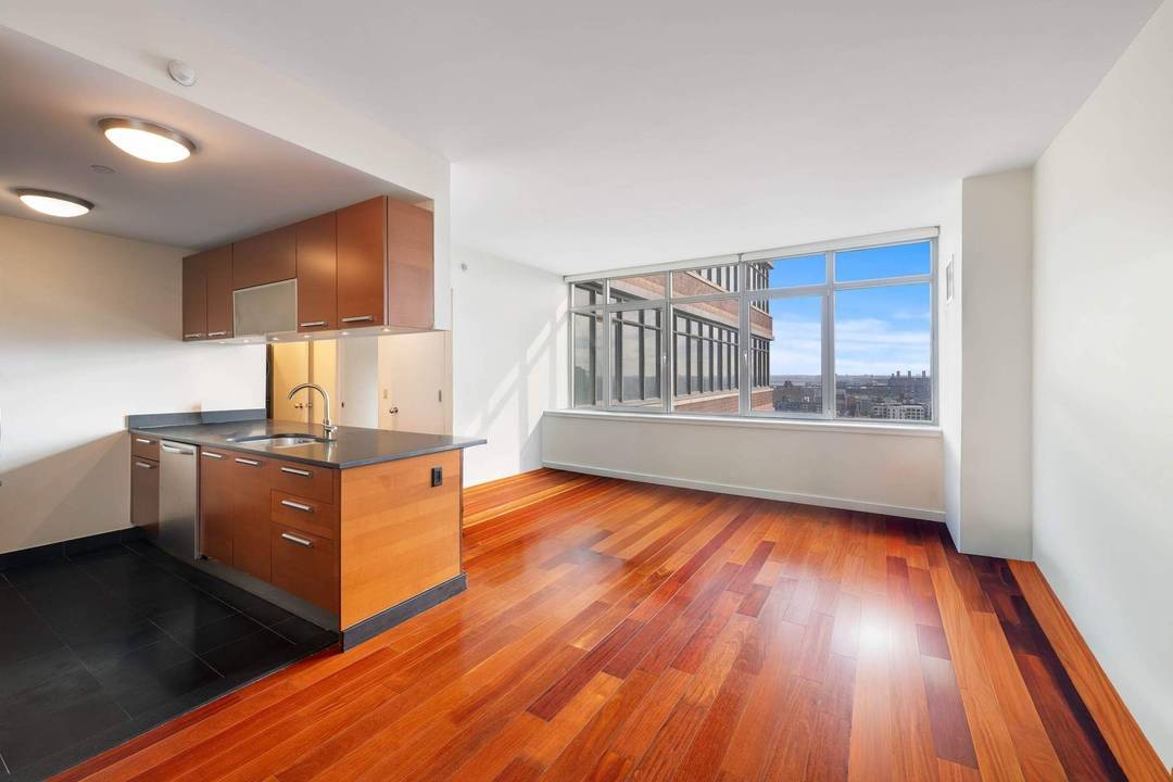 Welcome to Residence 22C at 1485 Fifth Avenue a sun drenched one bedroom, one bath home soaring high above East Harlem in a full service luxury building.