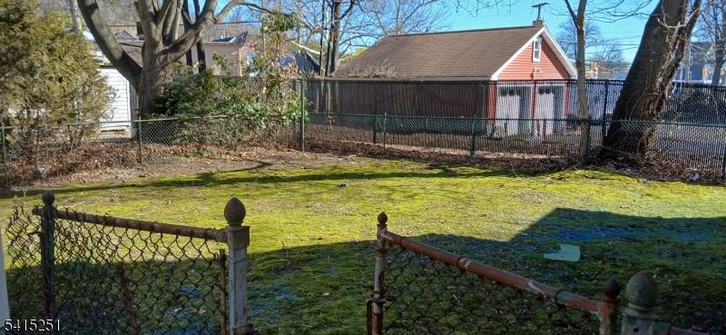 Large Colonial. Kit w pass thru to Din Rm w FP, enclosed porch, 4 spacious bdrms, Enclosed Porch All Season Rm, walk up attic, full unfin bsmt.