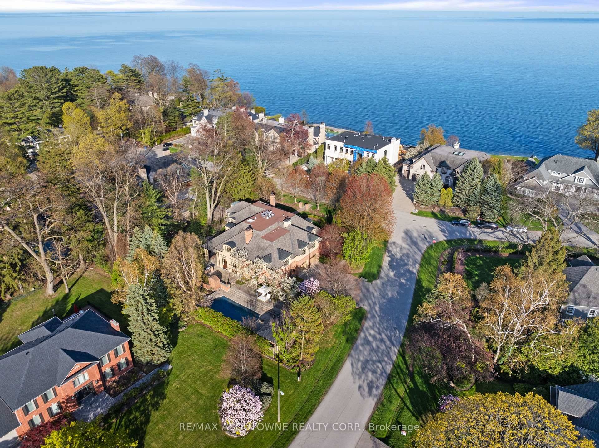 A masterclass in scale and proportion, this custom built residence is quietly positioned on 1 2 acre in one of South East Oakville's most prestigious and tranquil enclaves.