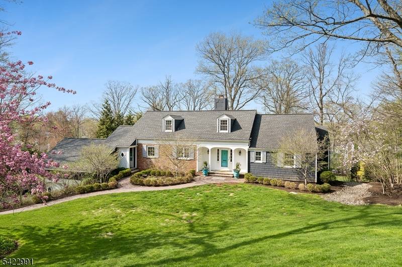 Exceptional 6BR, 4. 1BA custom Colonial set on a lush 0.