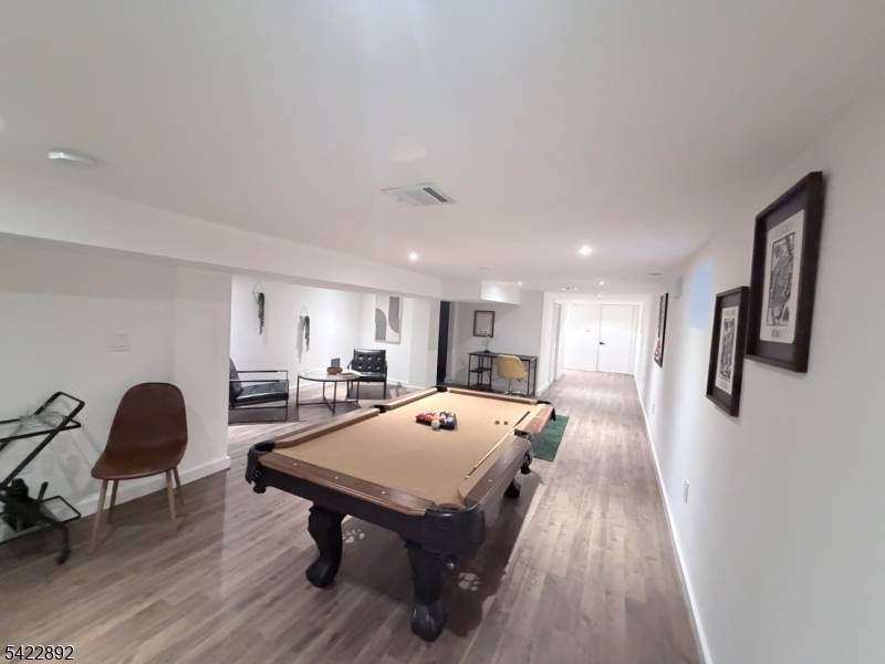 Welcome to this exceptional, fully renovated two family residence offering refined living, modern design, and outstanding versatility.