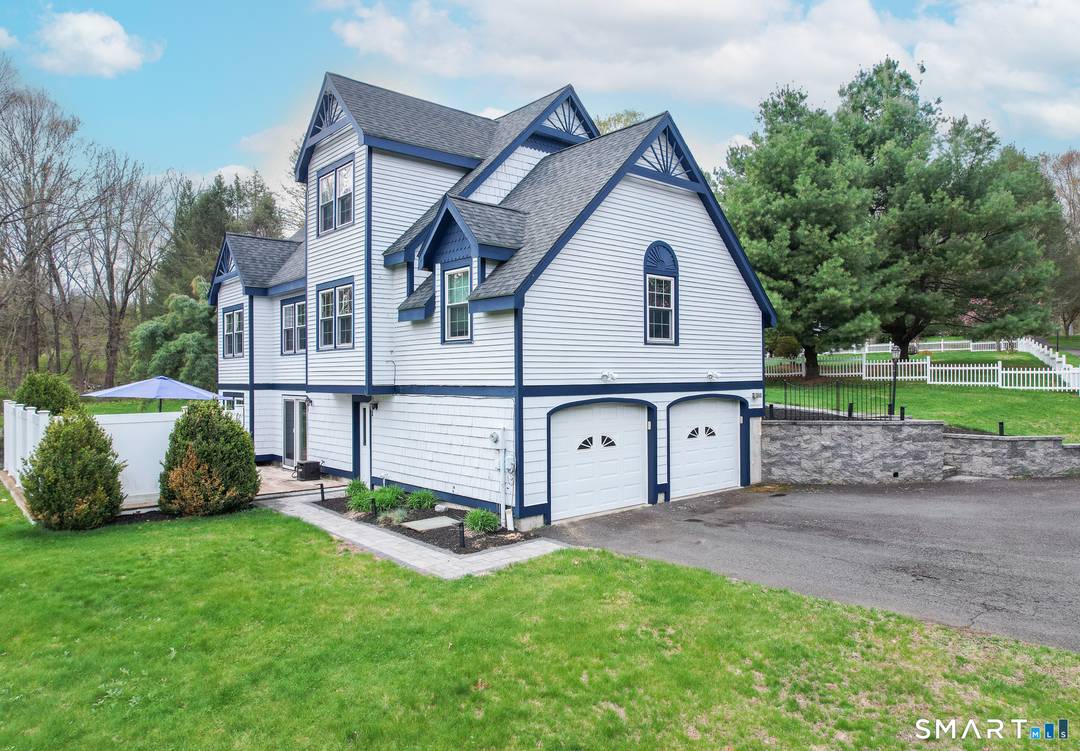 Welcome to this beautiful Cape Cod style home, perfectly set back.