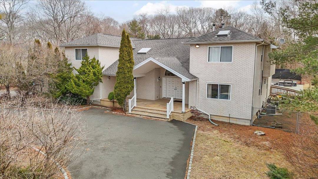 Discover this impressive 6 bedroom home in the charming hamlet of Remsenburg, just minutes from the beautiful Hampton beaches.