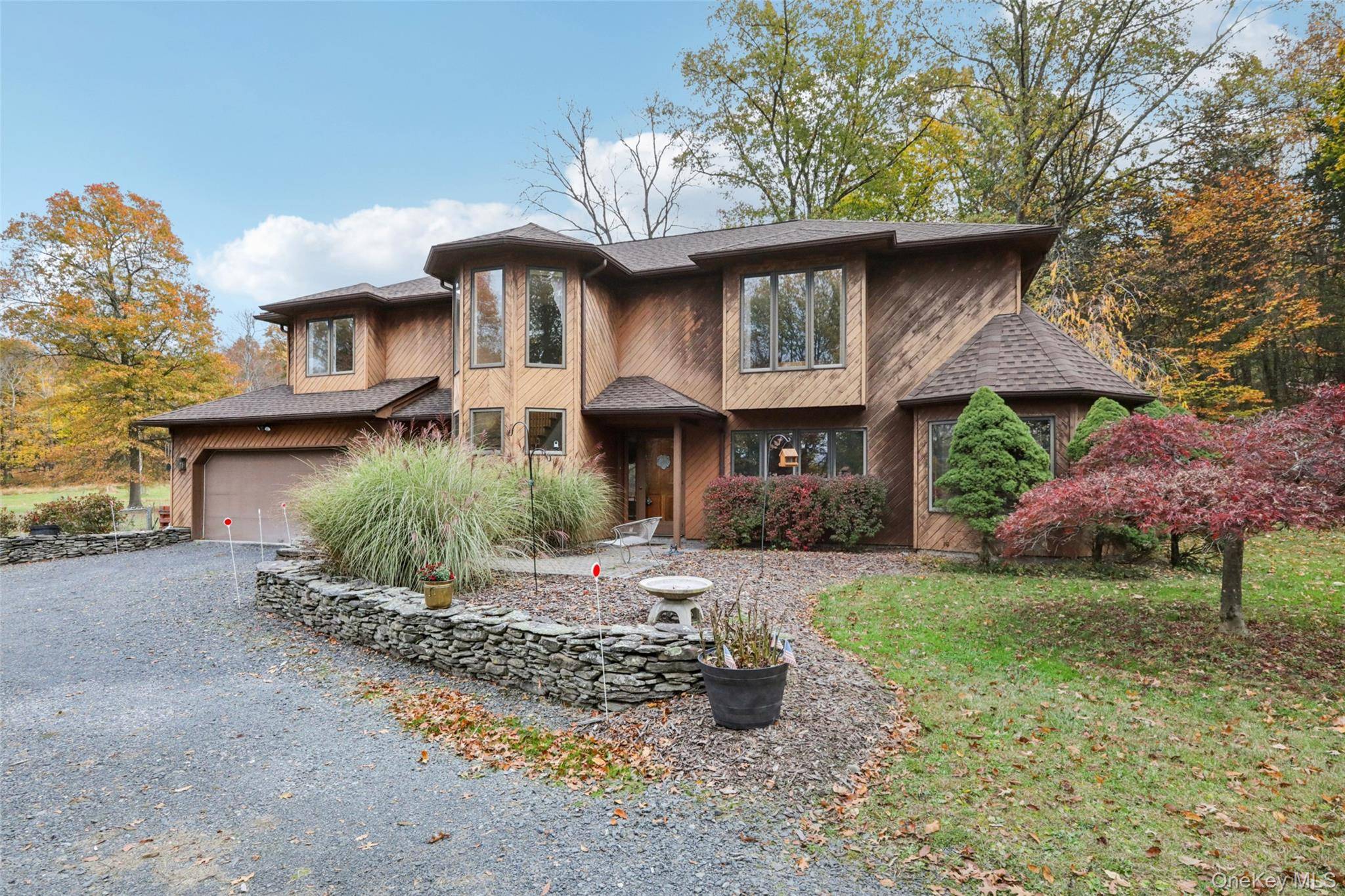 Tucked away on 8. 5 acres of gently rolling land, this contemporary home is a sanctuary for those who crave space, quiet and a connection to nature.