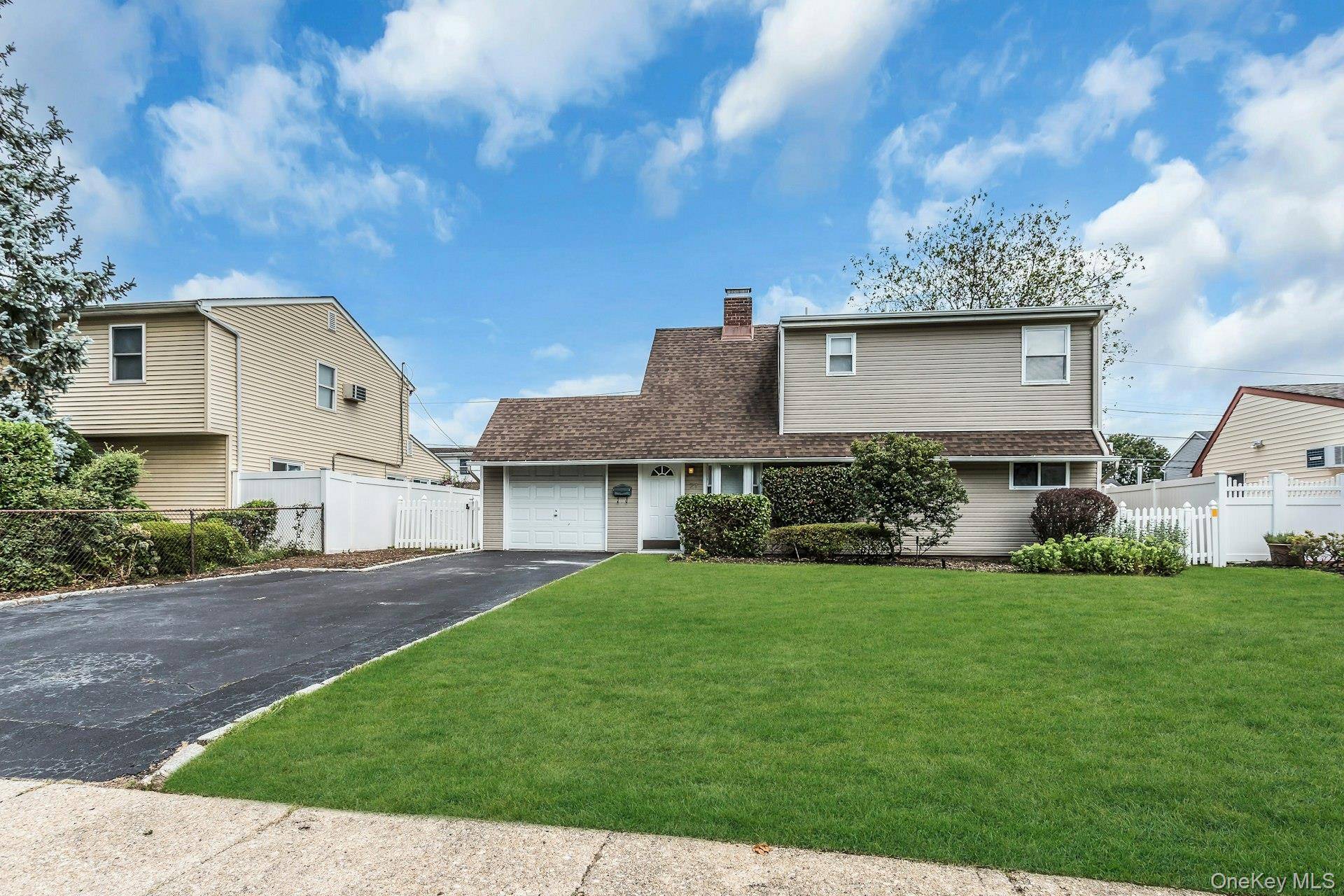 Lovely expanded ranch in the heart of Hicksville, featuring an open and inviting floor plan with 4 generously sized bedrooms and 2 full bathrooms.