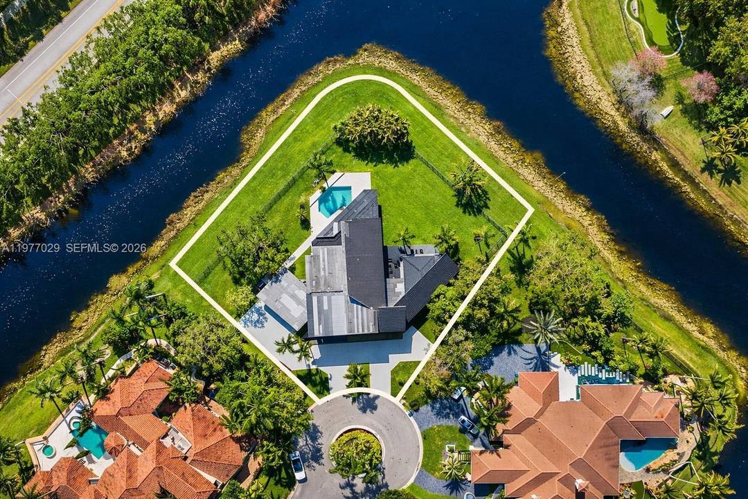 Rare offering in Windmill Ranch Estates featuring one of the largest waterfront cul de sac point lots currently available in the community.