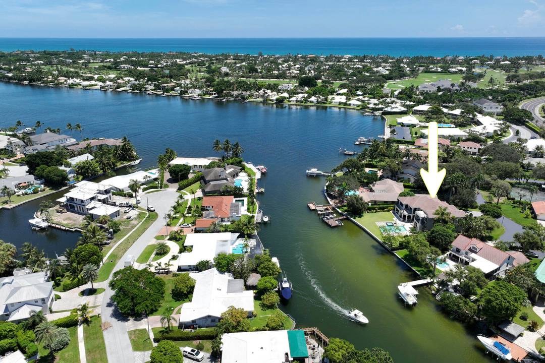 Discover timeless elegance in this stunning two story waterfront estate located in the gated community of Portage Landing.
