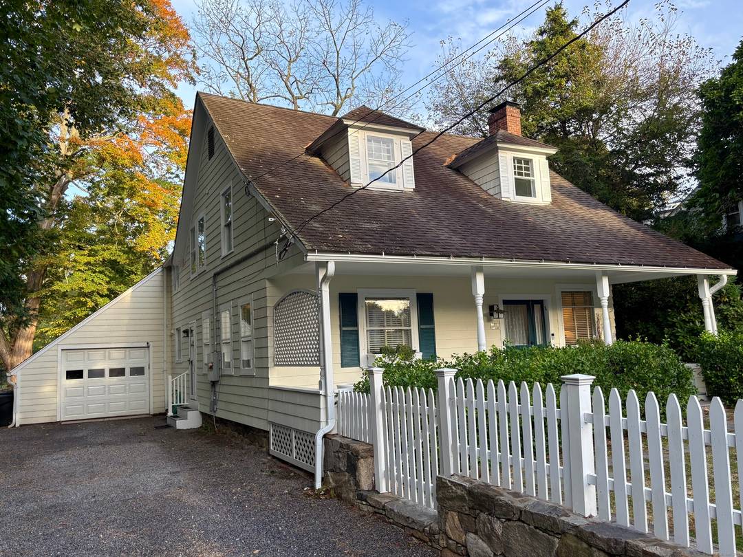 An inviting front porch welcomes you home to this light filled historic four bedroom cape within walking distance to the wonderful town of Westport.