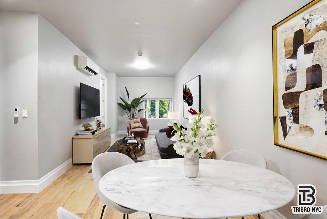Modern 2BR 2BA apartment featuring an open concept layout, in unit washer dryer, and sleek finishes throughout.
