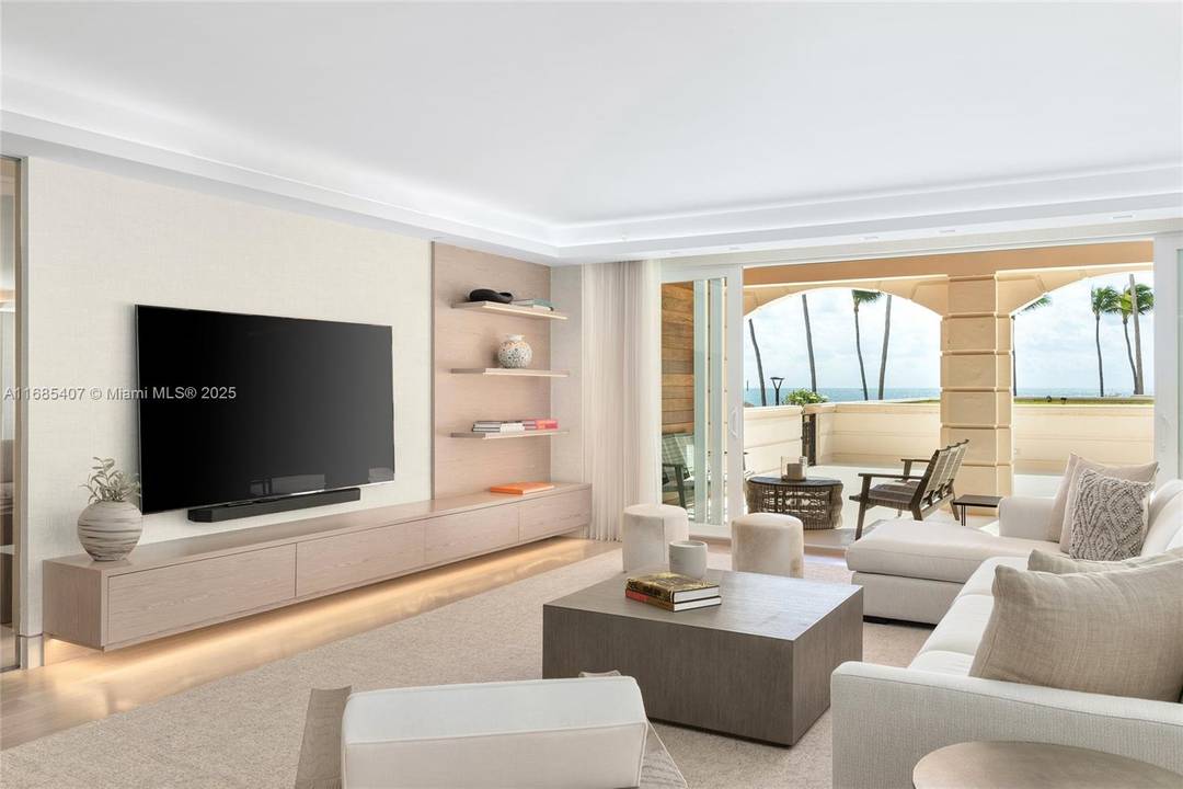 Discover the epitome of luxury living in this exquisite ground floor unit on Fisher Island, perfectly situated steps away from the pool, beach, scenic walking paths amp ; Atlantic Ocean.