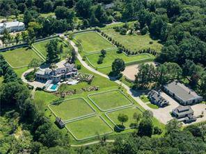 Turn key equestrian estate includes magnificent, award winning home w pool, Indoor and Outdoor riding rings with custom footing, state of the art 8 stall stable and separate 2 bedroom ...