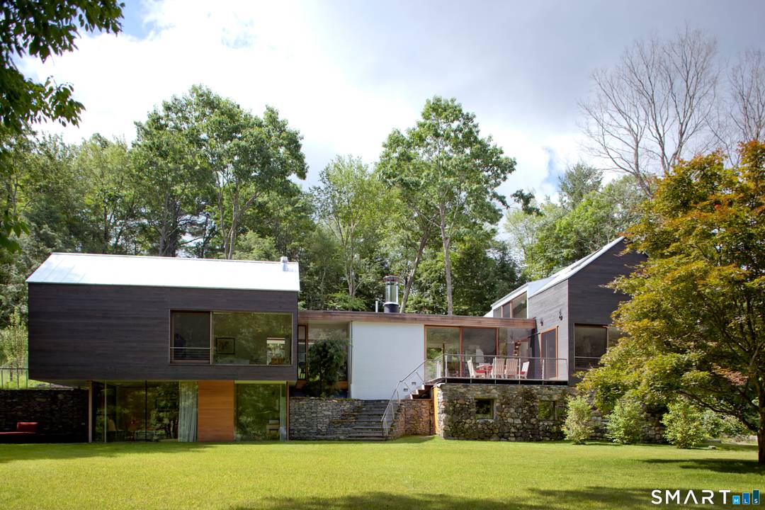 The Depot House. Modern Masterpiece with in ground Gunite pool overlooking a lush level lawn leading down to the Bantam River.