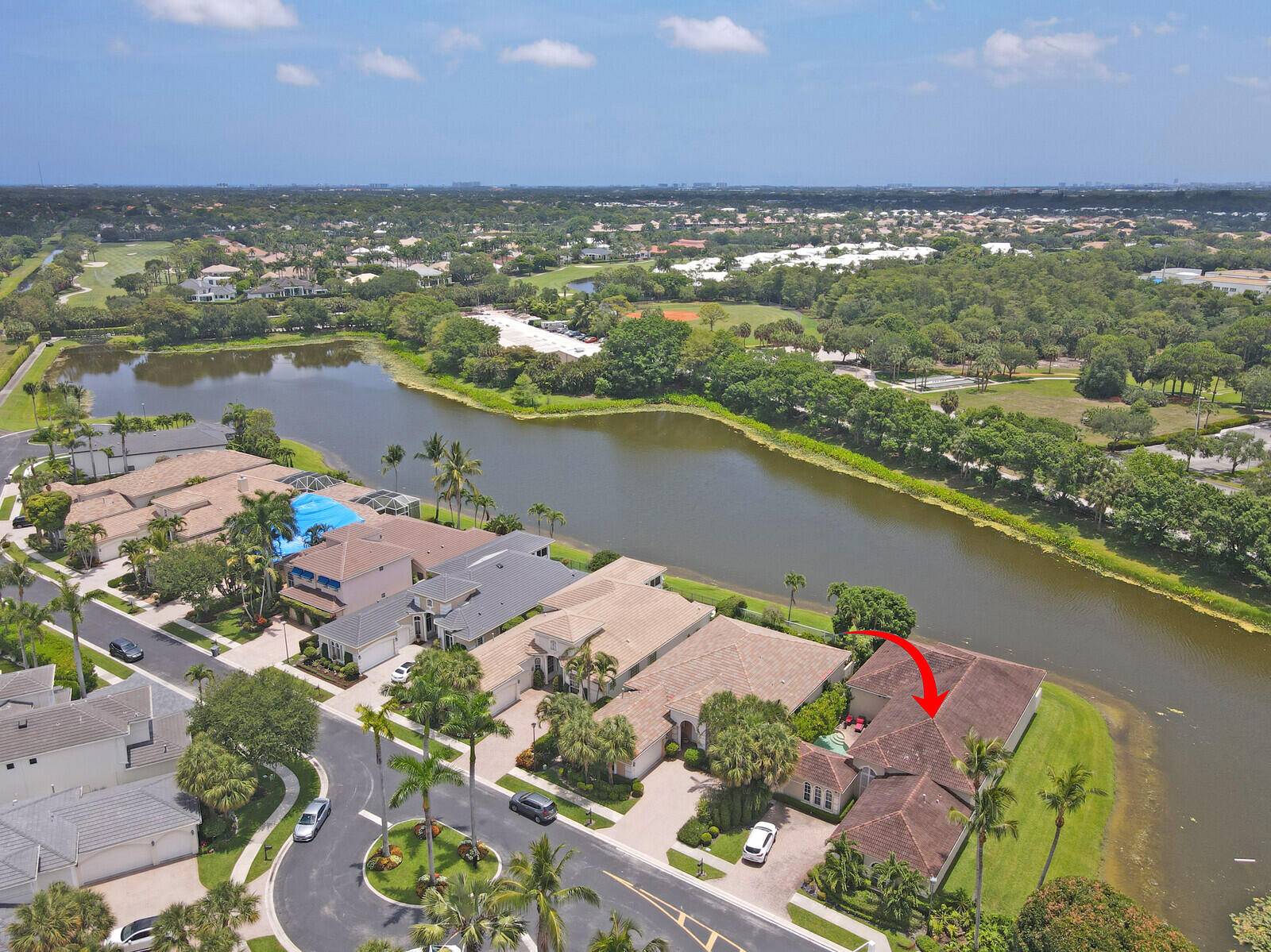 Experience luxury in this private courtyard home with stunning lake views.