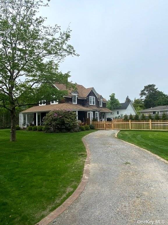 Completely remodeled and renovated large traditional two story home with wrap around porch, new in ground heated pool and blue stone patio surround.