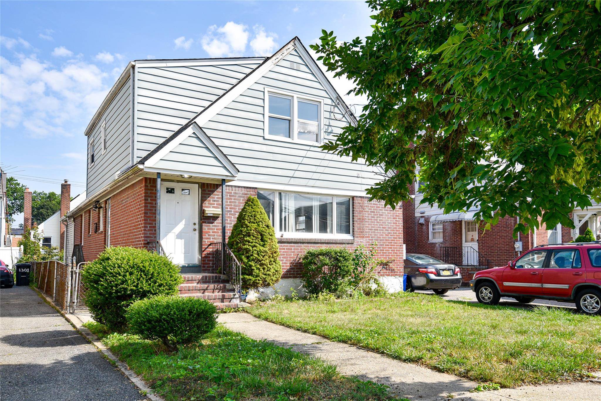 Welcome to 1305 Belmont Avenue, a beautifully updated Colonial home located in the heart of highly sought after New Hyde Park.