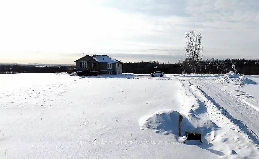 94 Acre Countryside Retreat with Custom Built Bungalow !