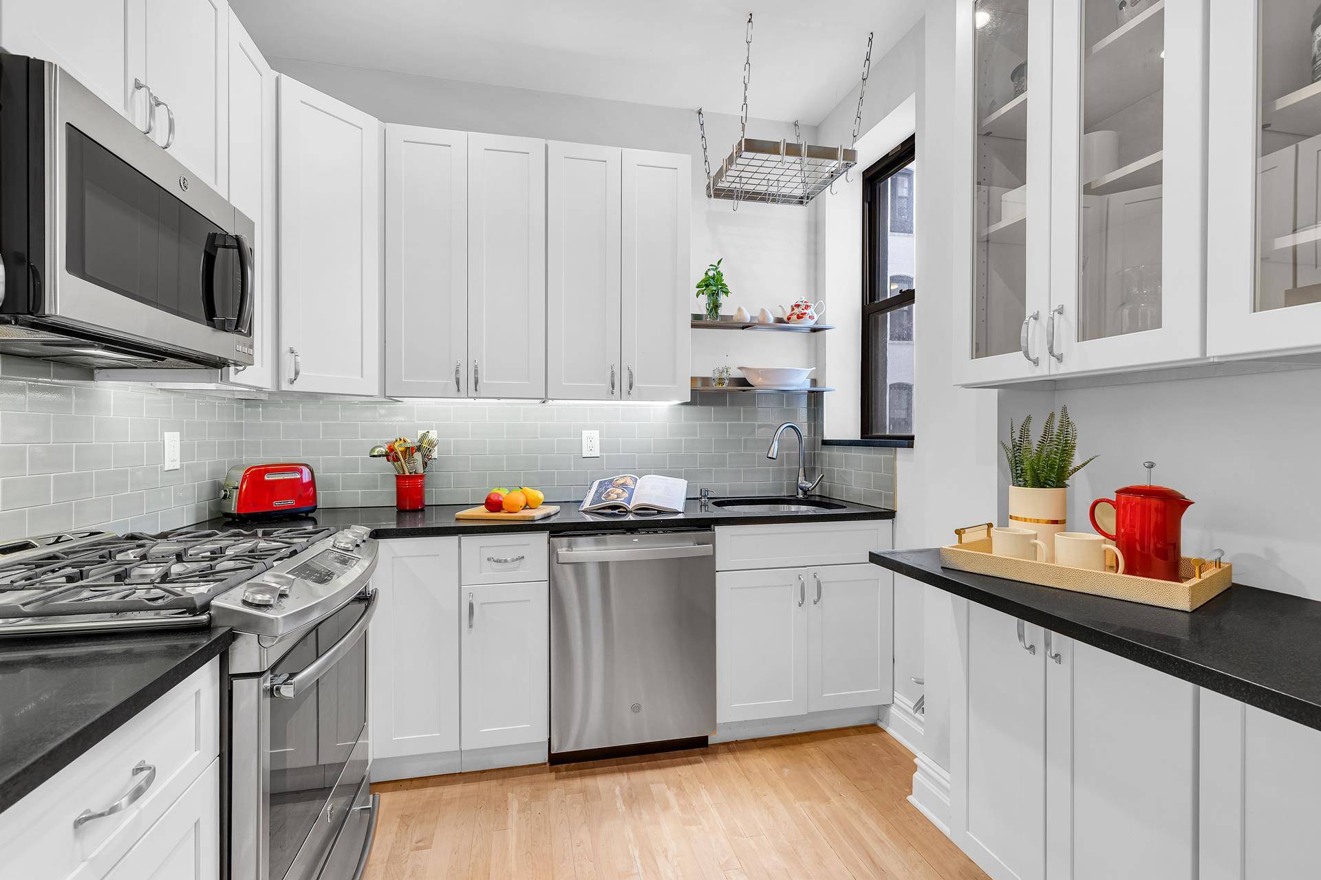 This perfectly proportioned two bedroom home is smartly laid out with greenery outside every room, including the windowed kitchen and bath.