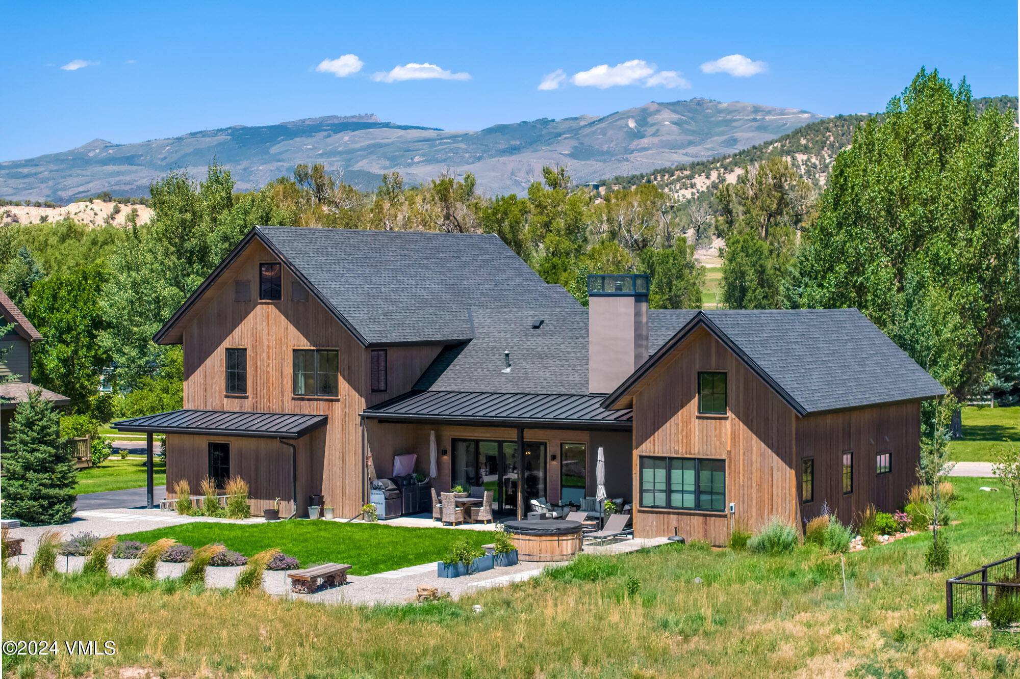 Discover this captivating modern farmhouse design located in the sought after Eagle Ranch.