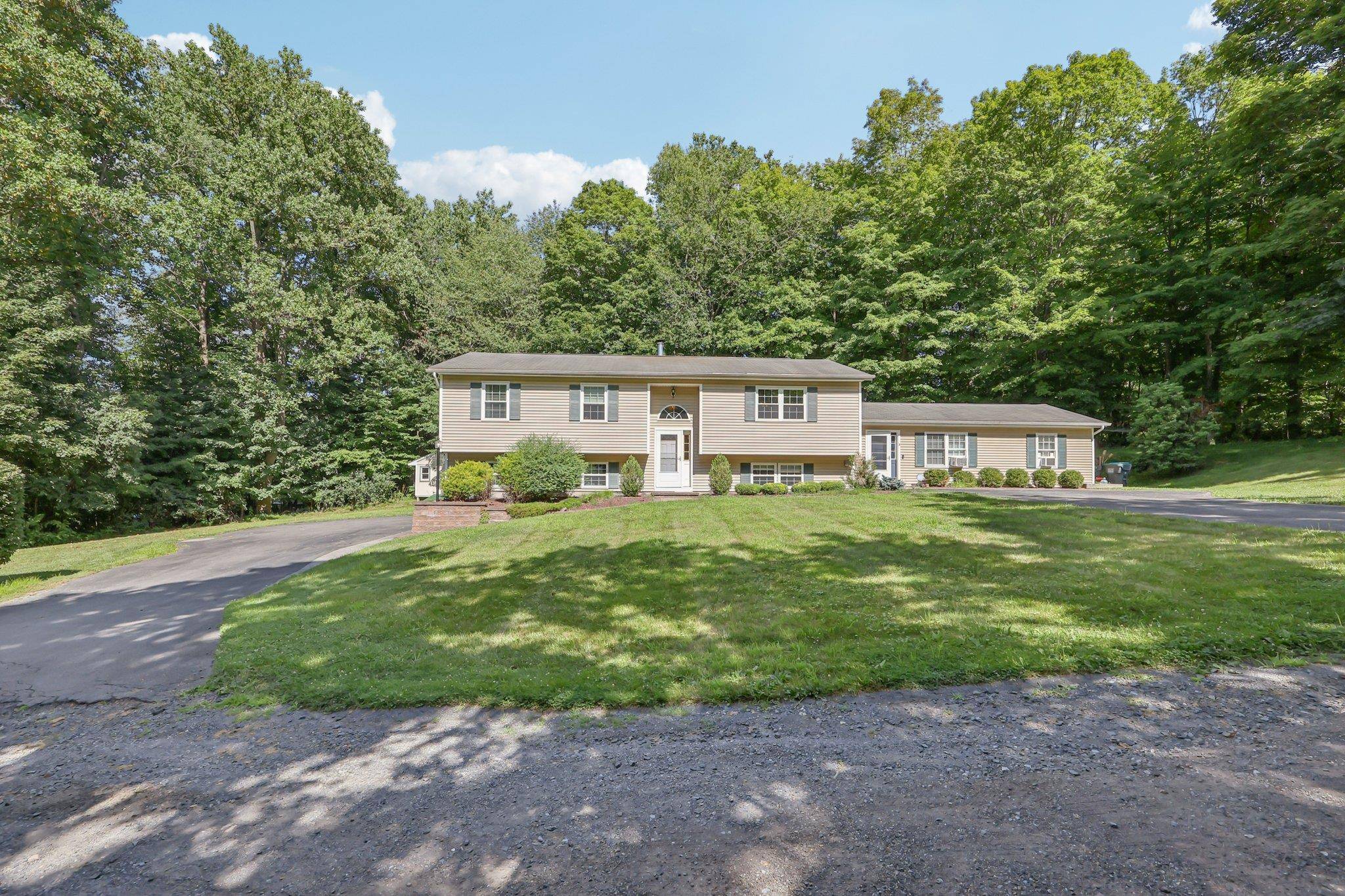 Nestled on over an acre of level, private land, this legal two family residence presents a rare opportunity for multi generational living, rental income, or smart investing.