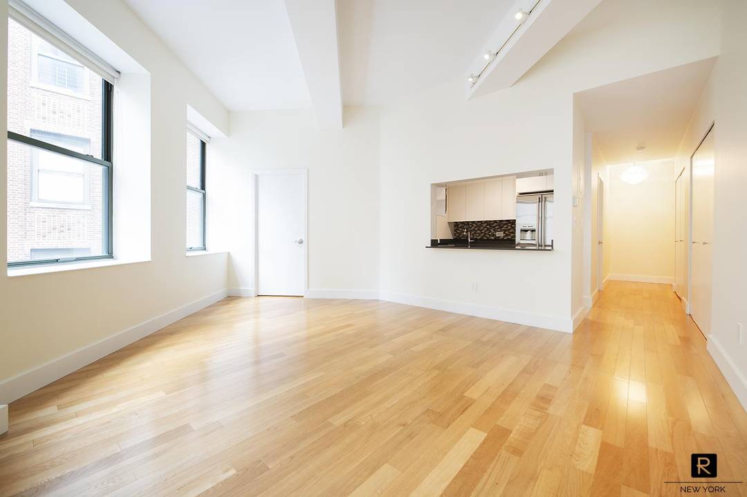 Beautifully renovated and freshly painted two bedroom, one bath home featuring 11 foot loft style ceilings and bright southwest exposure that fills the space with natural light.