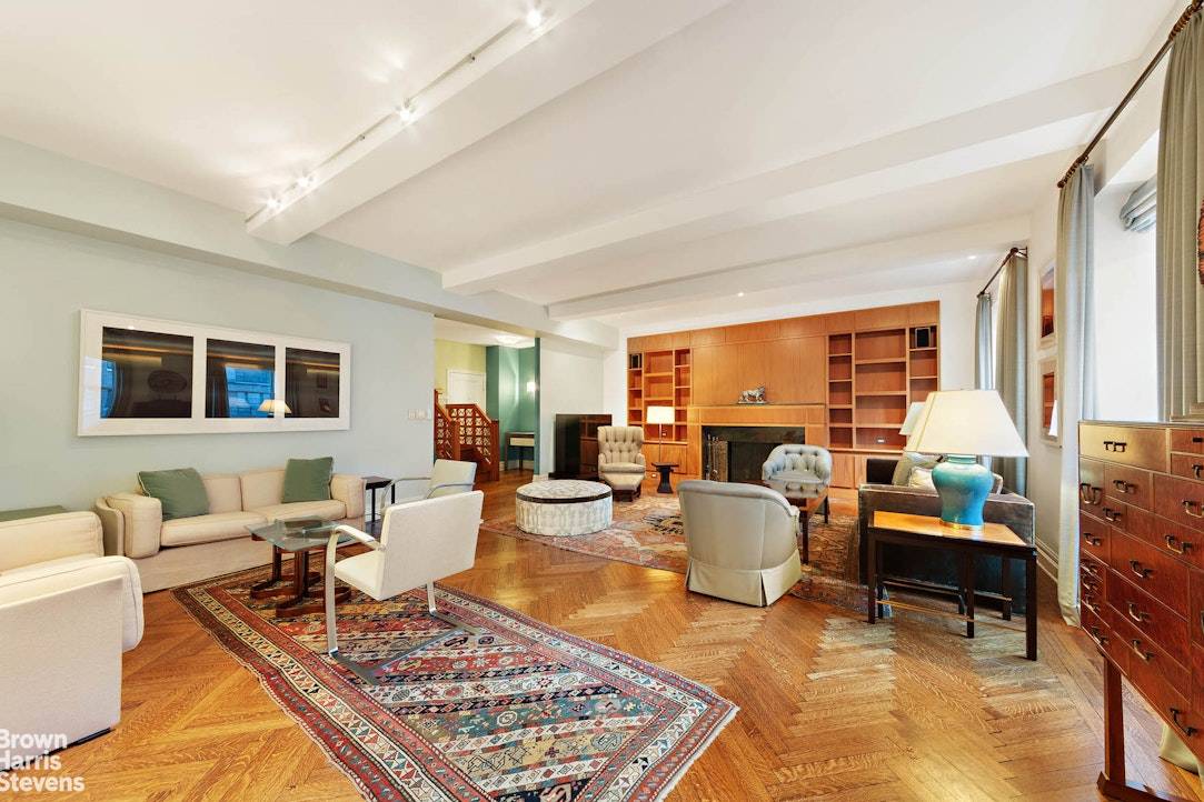 This fabulous and enormous high floor duplex in a top white glove prewar features huge south facing windows and light and air in every single room !