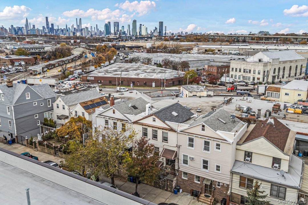 Welcome to this spacious three level home in the heart of Maspeth, offering four bedrooms, three full bathrooms, and captivating views of the Manhattan skyline.