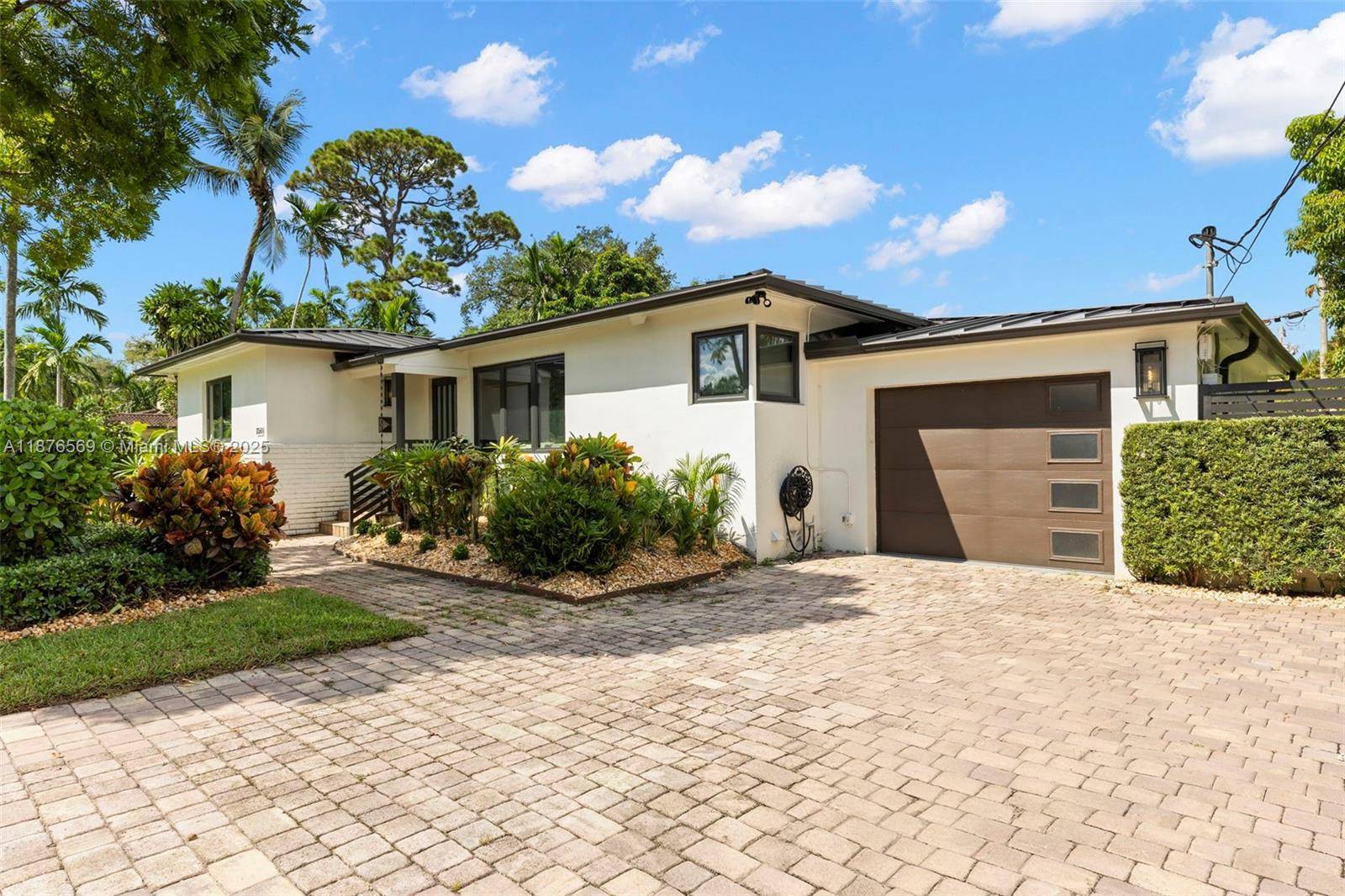 Stunning Miami Shores Executive Residence, thoughtfully renovated throughout with the finest finishes and fixtures.